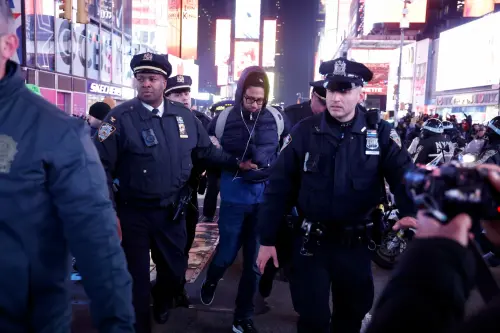 A man is detained after his arrest for vandalizing a NYPD car in Times Square as the beating video of Tyre Nichols is released on January 27, 2023 in New York City.