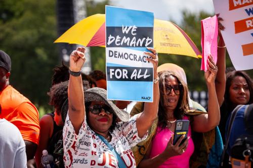 People cheer a speaker during a demonstration marking the 60th anniversary of the March on Washington and Dr. Martin Luther King Jr.’s “I Have a Dream” speech. The event was hosted by National Action Network and the Drum Major Institute to both commemorate the 1963 march and call for continued work toward racial equality in the United States.