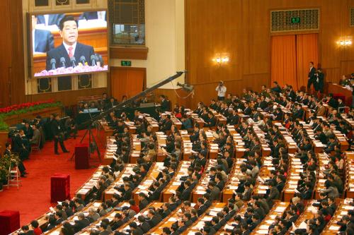 Chinese representatives watch a big screen while Jia Qinglin, member of the Standing Committee of the Political Bureau of the CPC Central Committee and Chairman of the Chinese Peoples Political Consultative Conference (CPPCC) National Committee, speaks during the First Session of the 11th National Committee of the Chinese Peoples Political Consultative Conference (CPPCC) at the Great Hall of the People in Beijing 3 March 2008.The annual meeting of the Consultancy Congress ( Upper House) started on March 3 and will end on March 14, 2008. It always preceeds the annual meeting of the National Peoples Congress, the parliament of China.No Use China. No Use France.