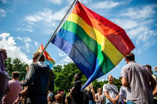 A protester holds a rainbow flag during the demonstration.