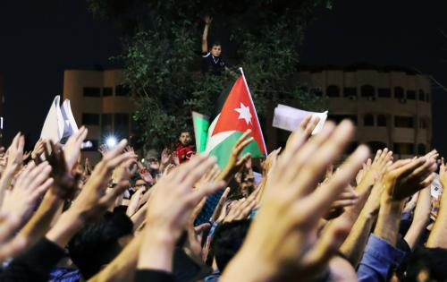 People rise hands during a protest near the Prime Minister's office in Amman, Jordan June 6, 2018. REUTERS/ Ammar Awad